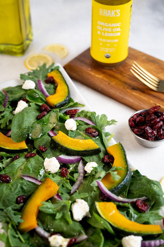 Olive Oil Lemon Spinach salad with Roasted Squash and Goat Cheese